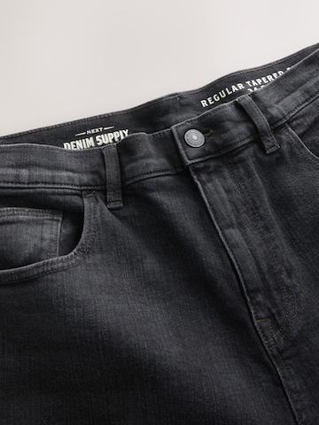 Next Tapered Jeans in Schwarz