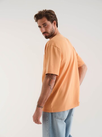 Tricou 'Lorenz' de la ABOUT YOU x Kevin Trapp pe portocaliu