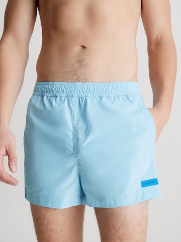 Calvin Klein Swimwear Board Shorts in Blue: front