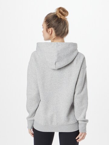 UNDER ARMOUR Sports sweatshirt 'Essential' in Grey