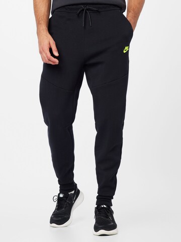 Nike Sportswear Tapered Pants in Black: front