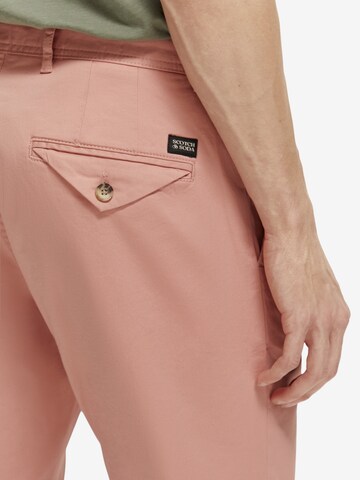 SCOTCH & SODA Ozke Chino hlače 'STUART' | roza barva
