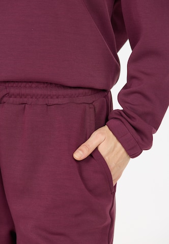 Athlecia Tapered Sports trousers 'Jacey' in Red