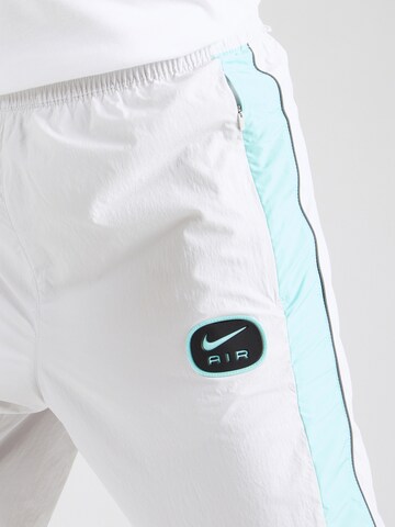 Nike Sportswear Loose fit Trousers 'AIR' in White