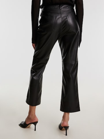 Bootcut Pantaloni 'Sia' di EDITED in nero