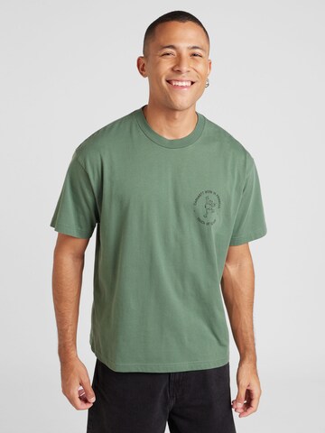 Carhartt WIP - Camiseta 'Stamp' en verde