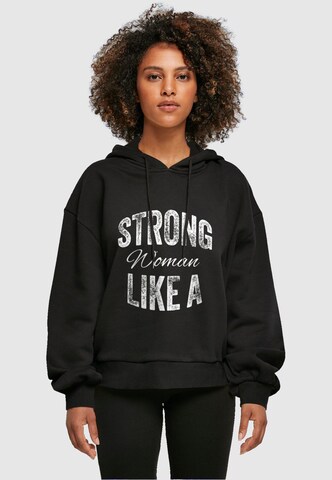 Merchcode Sweatshirt 'WD - Strong Like A Woman' in Schwarz: predná strana