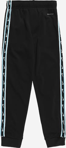 Tapered Pantaloni di Nike Sportswear in nero