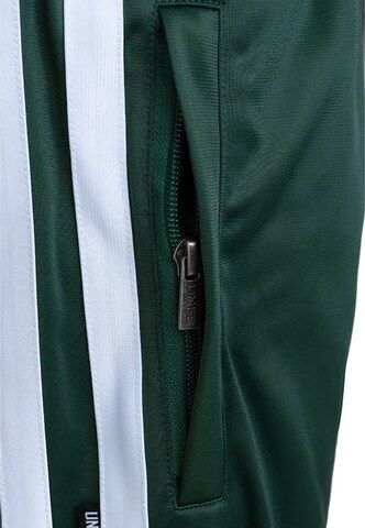 Loosefit Pantaloni sportivi 'DMWU Evolution' di Unfair Athletics in verde