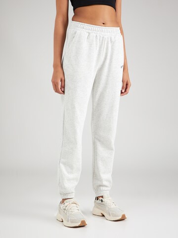 Athlecia Tapered Workout Pants in White: front