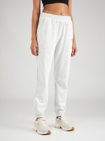 Athlecia - Tapered Pantalón deportivo en blanco: frente