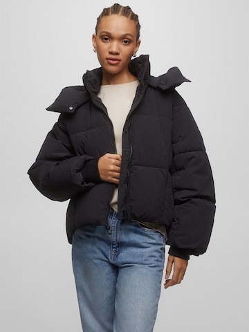 Pull&Bear Winter Jacket in Black: front