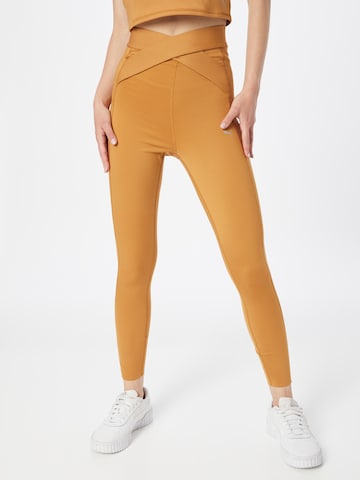 PUMA Skinny Workout Pants in Brown: front