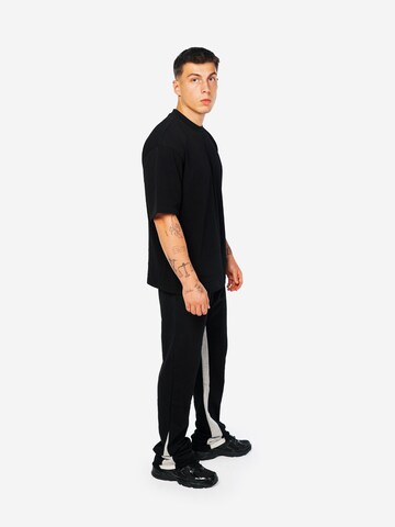 Loosefit Pantaloni sportivi 'AOF FLARED JOGGER' di ATELIER OF FAITH in nero: frontale