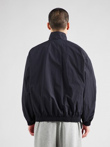Giacca di mezza stagione 'CLUB' di Nike Sportswear in nero