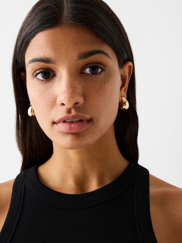 Boucles d'oreilles Bershka en or : devant