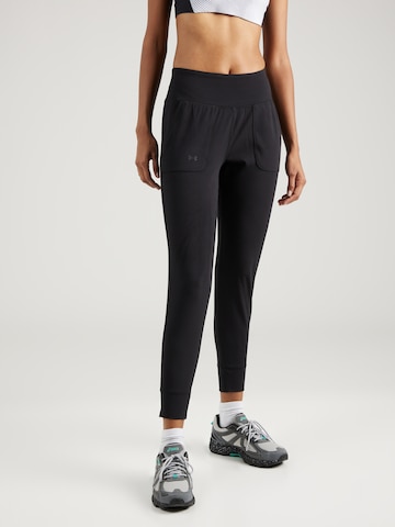 UNDER ARMOUR Tapered Workout Pants 'Motion' in Black: front