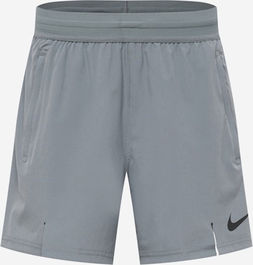 NIKE Regular Sports trousers in Grey: front