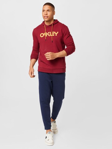 OAKLEY Αθλητική μπλούζα φούτερ σε κόκκινο