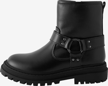 Next Saappaat värissä musta: etupuoli