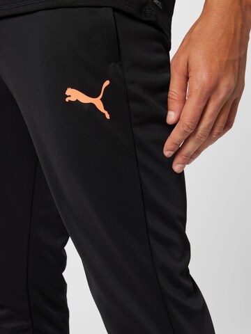 PUMA Tapered Sportbroek in Zwart