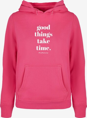 Merchcode Sweatshirt 'Good Things Take Time' in Roze: voorkant