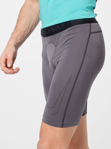 NIKE Skinny Sporthose in Grau