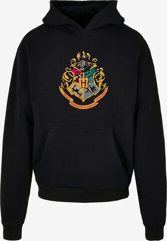 F4NT4STIC Sweatshirt 'Harry Potter Hogwarts Crest Gold' in Zwart: voorkant