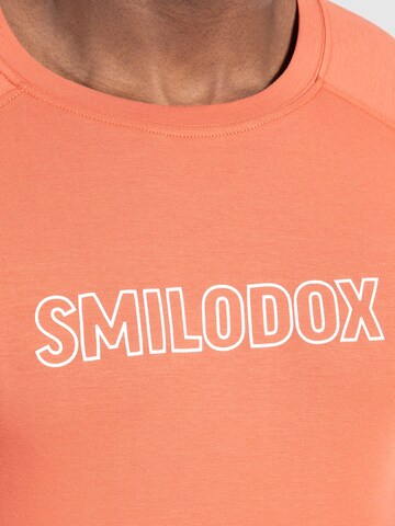 T-Shirt fonctionnel 'Timmy' Smilodox en orange