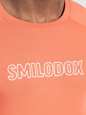 T-Shirt fonctionnel 'Timmy' Smilodox en orange