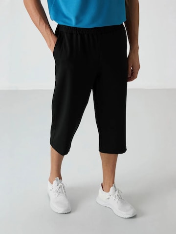 Pantalon Tommy Life en noir : devant