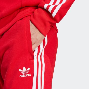 ADIDAS ORIGINALS Tapered Παντελόνι 'Adicolor Classics Sst' σε κόκκινο