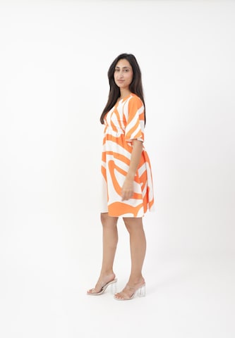 Elara Kjole i orange