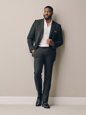 Slimfit Pantaloni con piega frontale 'Motionflex' di Next in verde