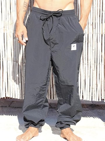 Surf Monkey - Loosefit Pantalón funcional en negro