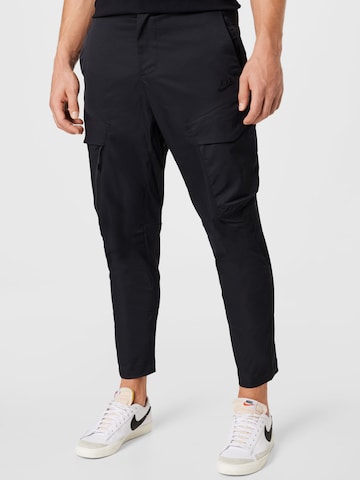 Nike Sportswear Slim fit Weatherproof pants in Black: front