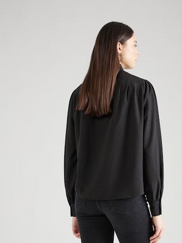 QS - Blusa en negro