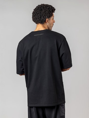 UNORGANIZED BRAND - Camiseta 'SCHWERES OVERSIZE T5' en negro