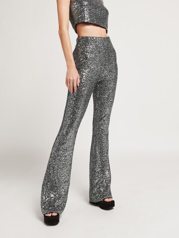 UNFOLLOWED x ABOUT YOU Flared Trousers 'HYPNOTIZED ' in Silver: front