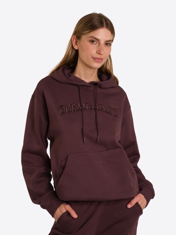 OCEANSAPART Sweatshirt 'Charly' in Brown: front