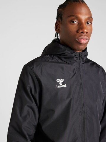 Veste de sport 'ESSENTIAL' Hummel en noir