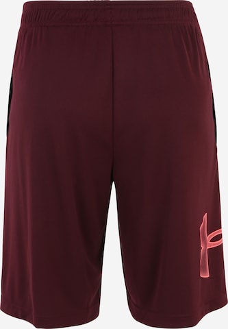 UNDER ARMOUR Loose fit Sports trousers in Red