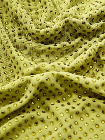 Top de la Next pe verde