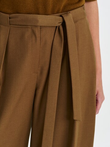 Wide leg Pantaloni con pieghe 'Anaiso' di TATUUM in verde