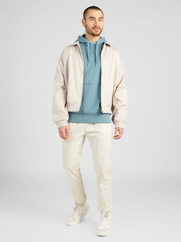 Tommy Jeans Tapered Housut 'AUSTIN' värissä beige