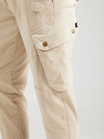 Tapered Pantaloni cu buzunare 'Combat' de la ALPHA INDUSTRIES pe bej