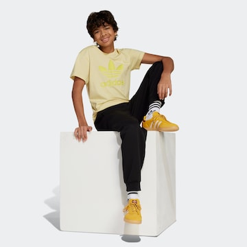 ADIDAS ORIGINALS Tapered Housut värissä musta
