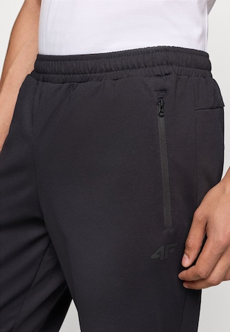 Tapered Pantaloni sportivi 'FNK' di 4F in nero