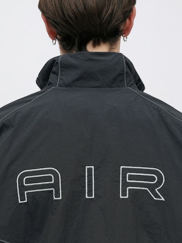 Veste mi-saison 'AIR' Nike Sportswear en noir