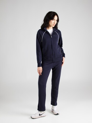 Champion Authentic Athletic Apparel Tracksuit in Blue: front